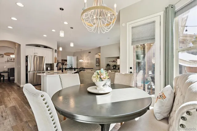 a kitchen with a dining table and chairs