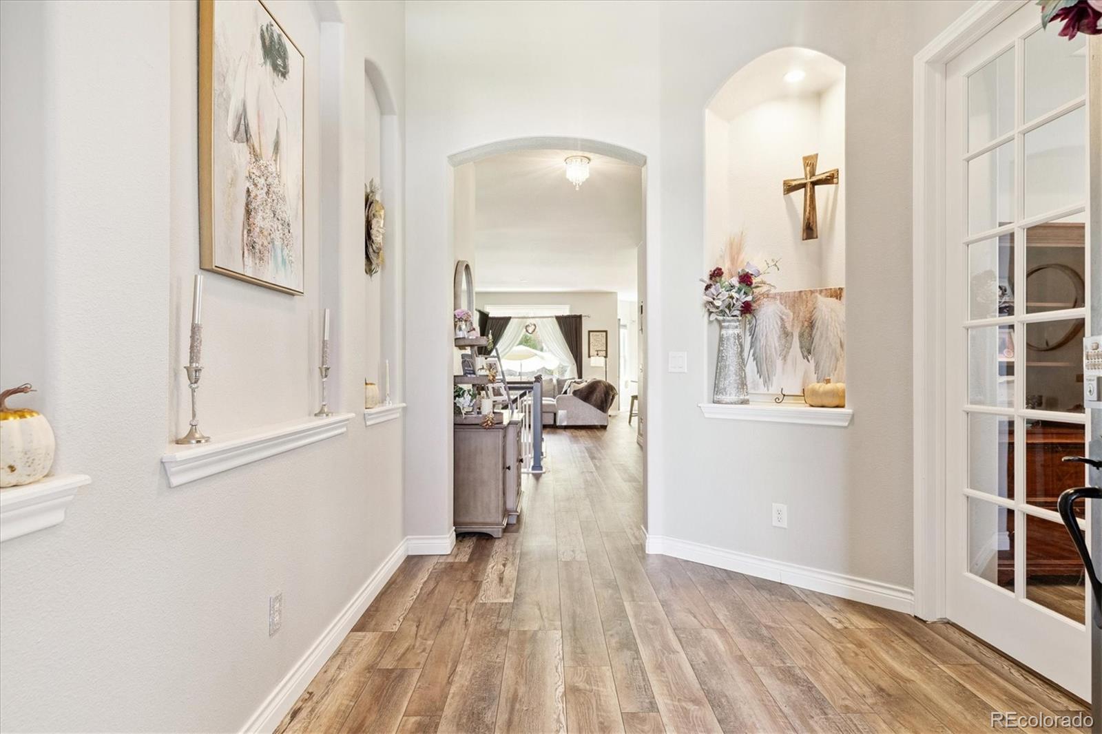 11641 Colony Loop Parker, CO 80138 - Photo 3 of 37 view of livingroom with furniture and wooden floor