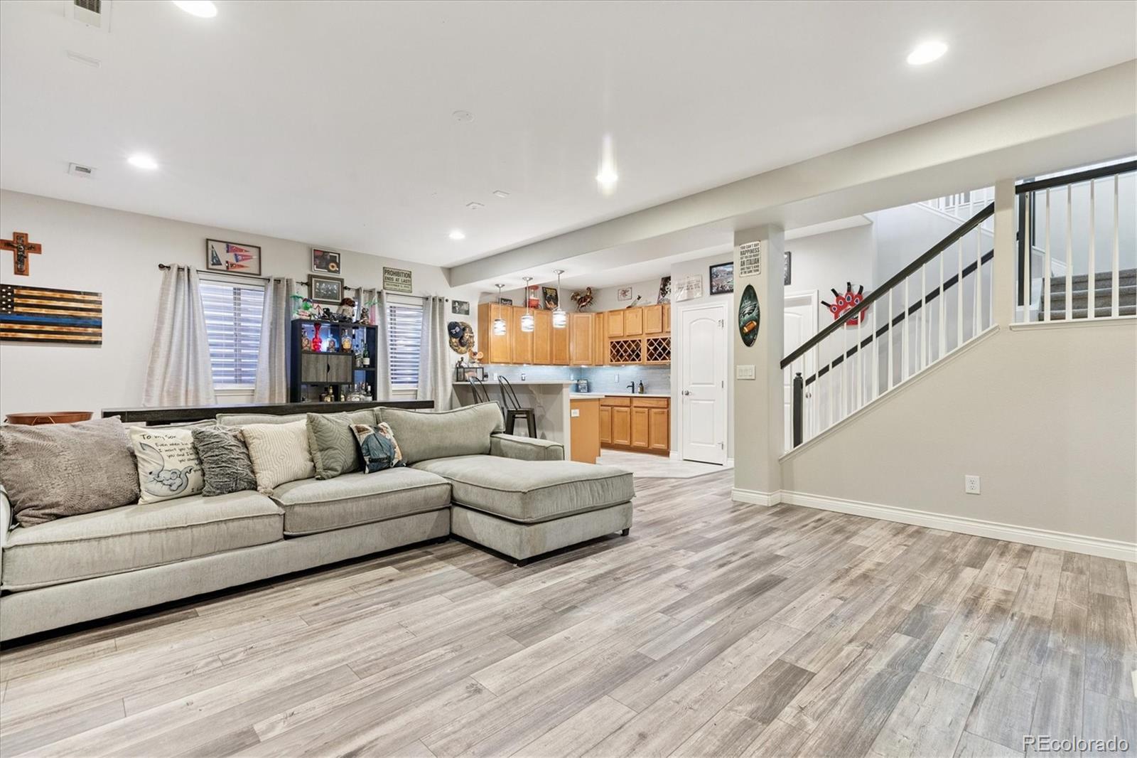 11641 Colony Loop Parker, CO 80138 - Photo 31 of 37 a living room with furniture and stairs