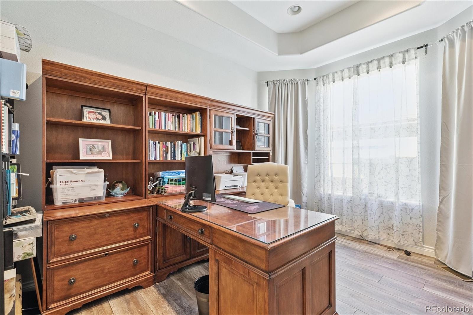 11641 Colony Loop Parker, CO 80138 - Photo 6 of 37 a view of a workspace with furniture and a window