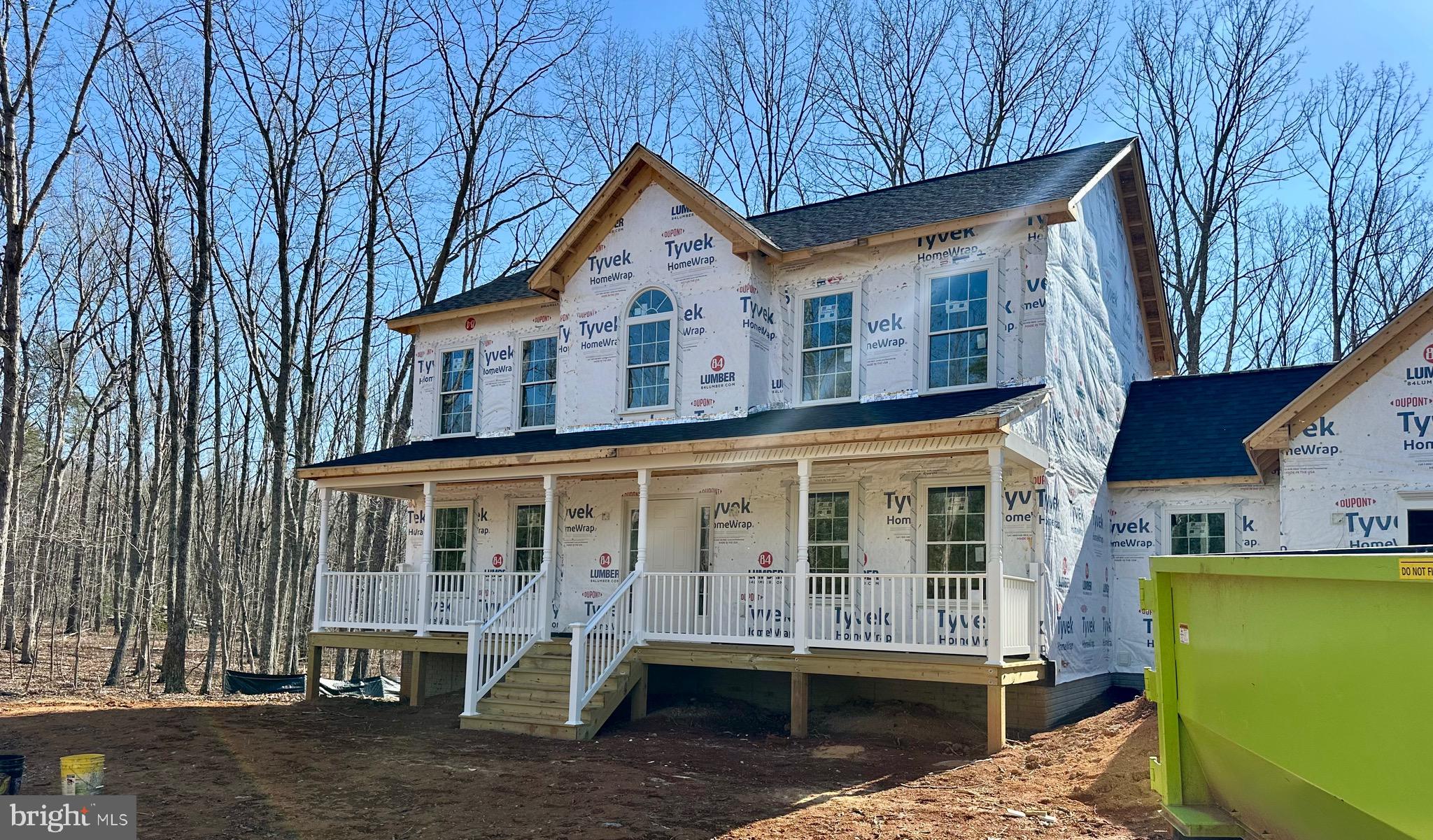 12267 Autumn Ridge Lane Unionville, VA 22567 - Photo 3 of 5 a front view of a house with a yard