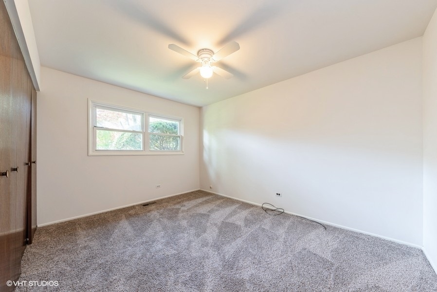 644 Raupp Boulevard Buffalo Grove, IL 60089 - Photo 8 of 23 a view of an empty room with a window