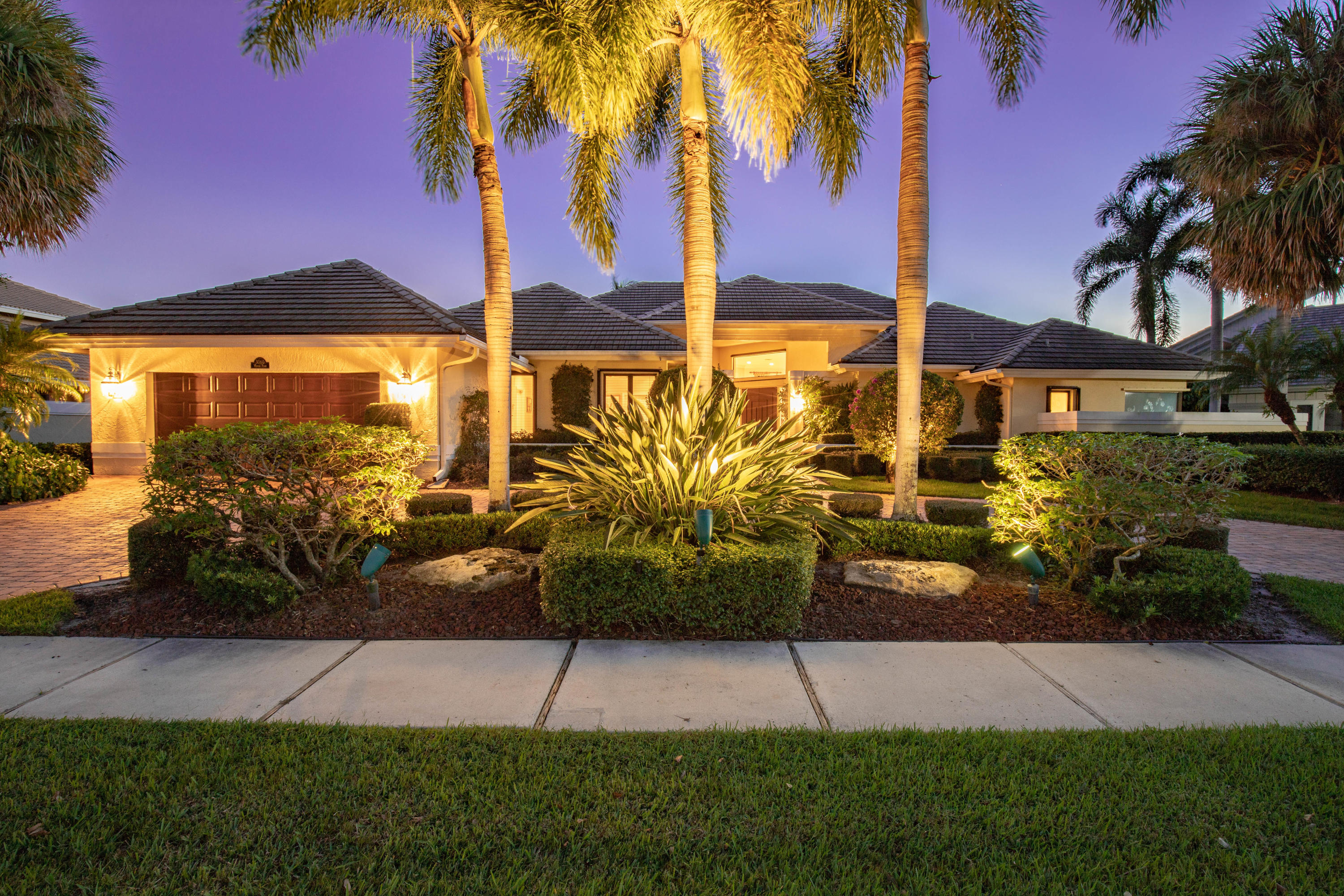 3060 Windsor Place Boca Raton, FL 33434 - Photo 1 of 18 a view of a street with a building in the background