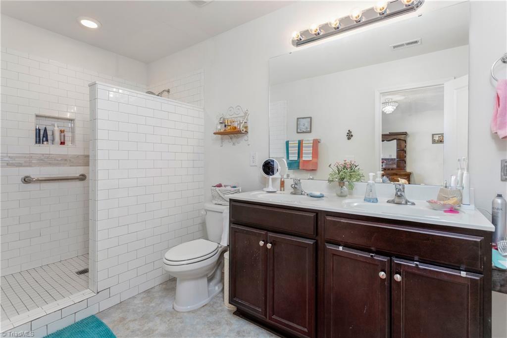 6413 Bentbrush Street Rural Hall, NC 27045 - Photo 18 of 31 Primary bathroom with custom tile shower!!