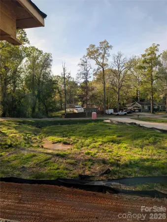 a view of a swimming pool with a yard