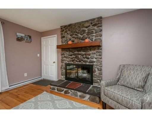 20 Launching Road Andover, MA 01810 - Photo 13 of 33 a living room with a couch and a fireplace