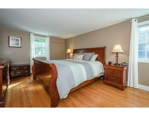 20 Launching Road Andover, MA 01810 - Photo 16 of 33 a bedroom with a bed and a night stand