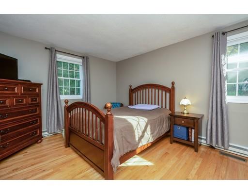 20 Launching Road Andover, MA 01810 - Photo 20 of 33 a spacious bedroom with a bed and a window