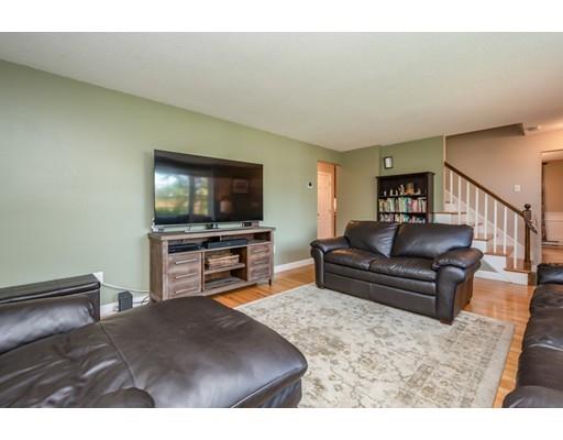 20 Launching Road Andover, MA 01810 - Photo 7 of 33 a living room with furniture and a flat screen tv