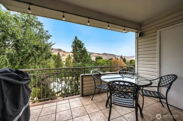 a view of balcony with furniture