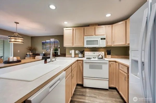 a kitchen with a sink cabinets and window