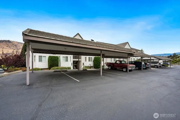 a view of a car park in front of house