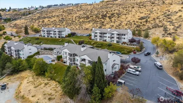 an aerial view of residential houses with outdoor space