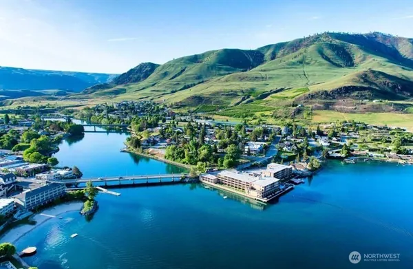an aerial view of a house with a lake view