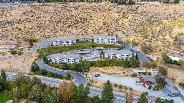 an aerial view of residential houses with outdoor space