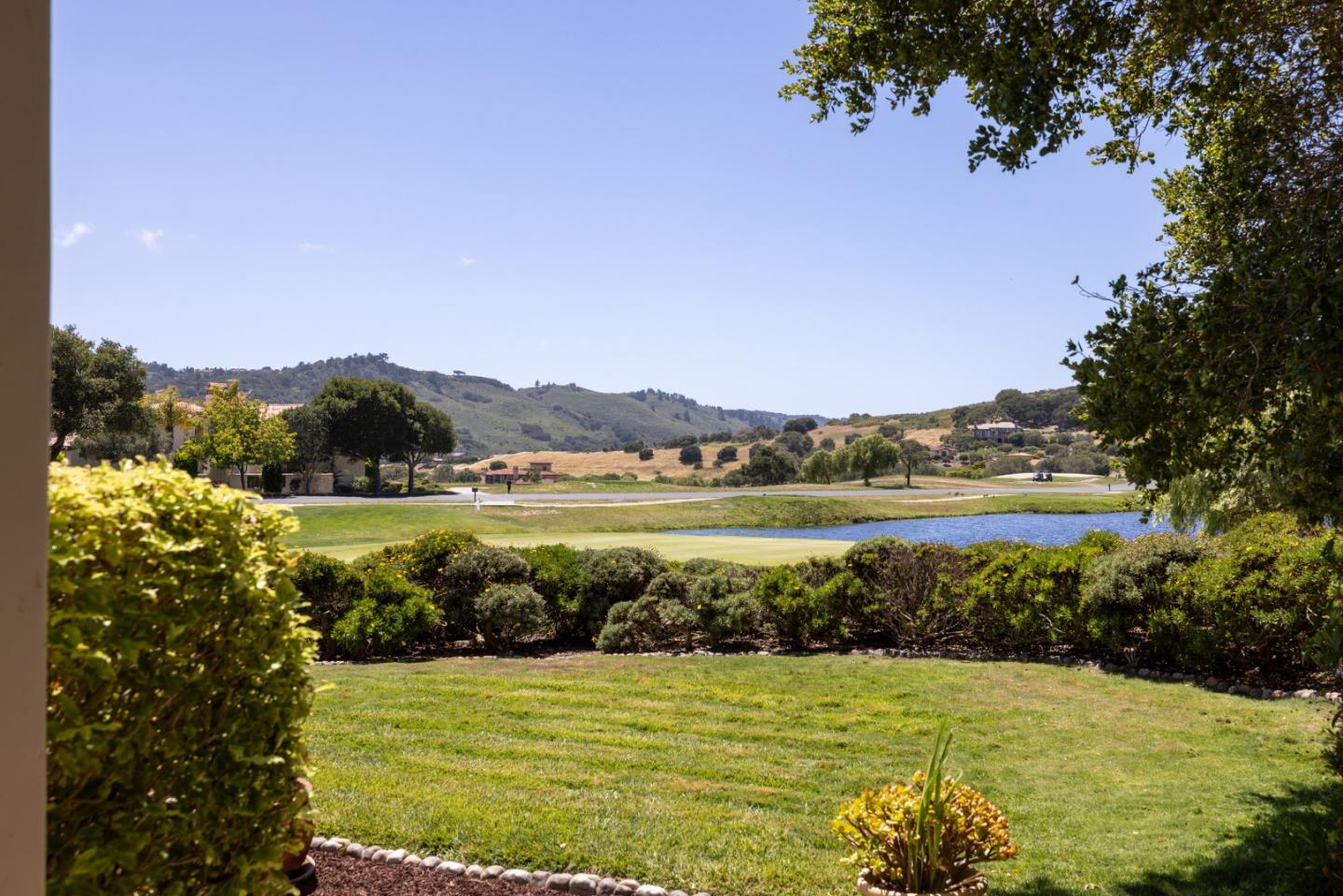 302 Pasadera Drive Monterey, CA 93940 - Photo 30 of 40 a view of a lake with a big yard