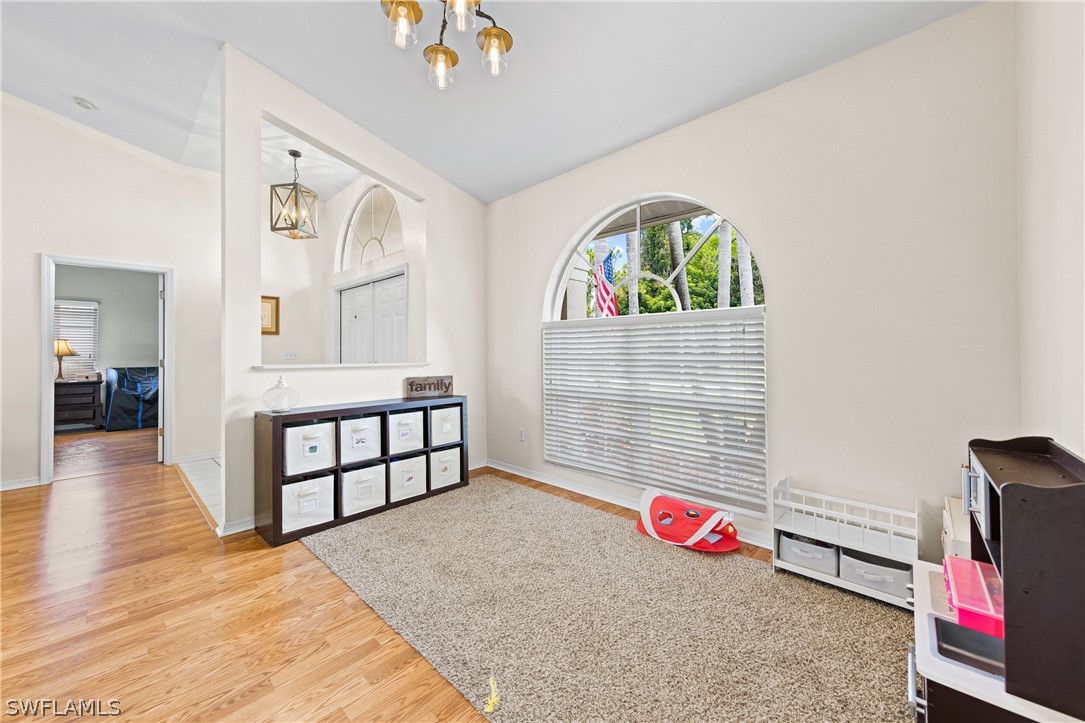 9132 Bryant Road Fort Myers, FL 33967 - Photo 12 of 23 a bedroom with furniture and a wooden floor