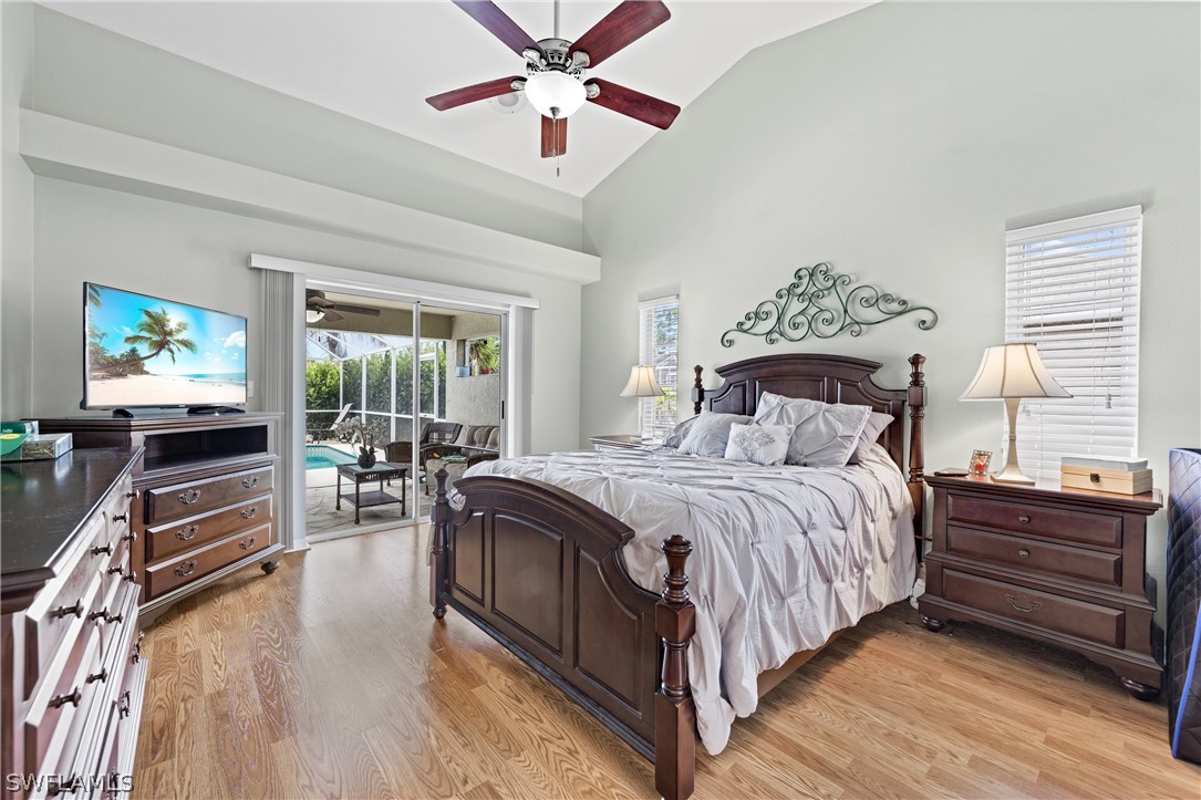 9132 Bryant Road Fort Myers, FL 33967 - Photo 13 of 23 a bedroom with a bed and wooden floor