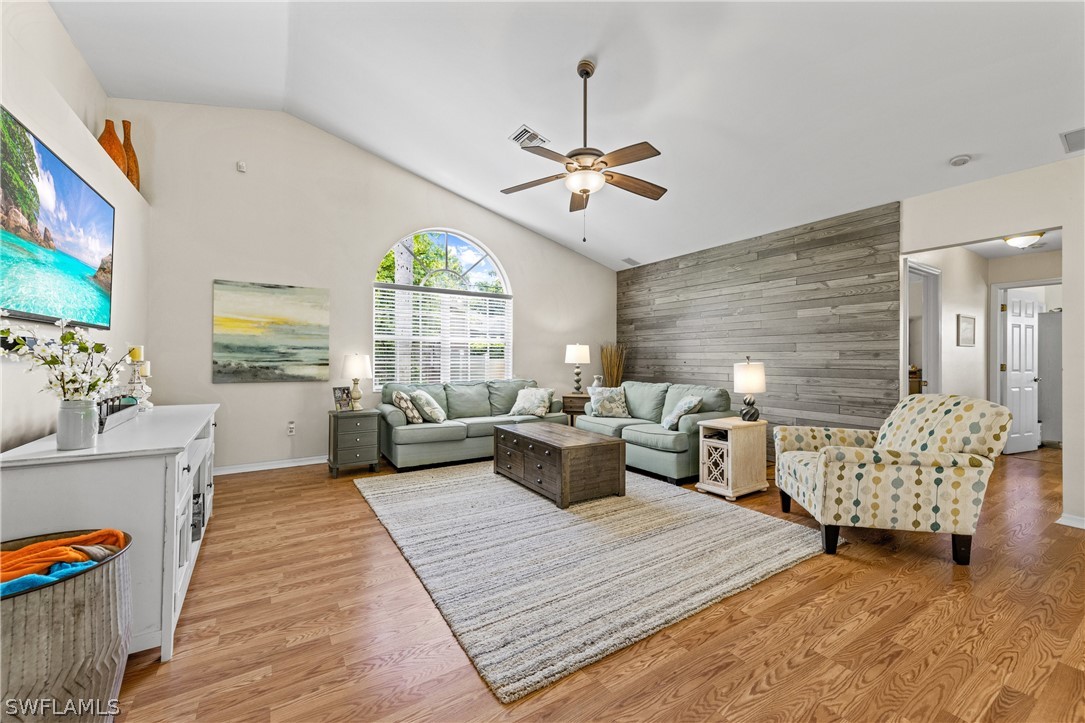 9132 Bryant Road Fort Myers, FL 33967 - Photo 2 of 23 a living room with furniture wooden floor and a window
