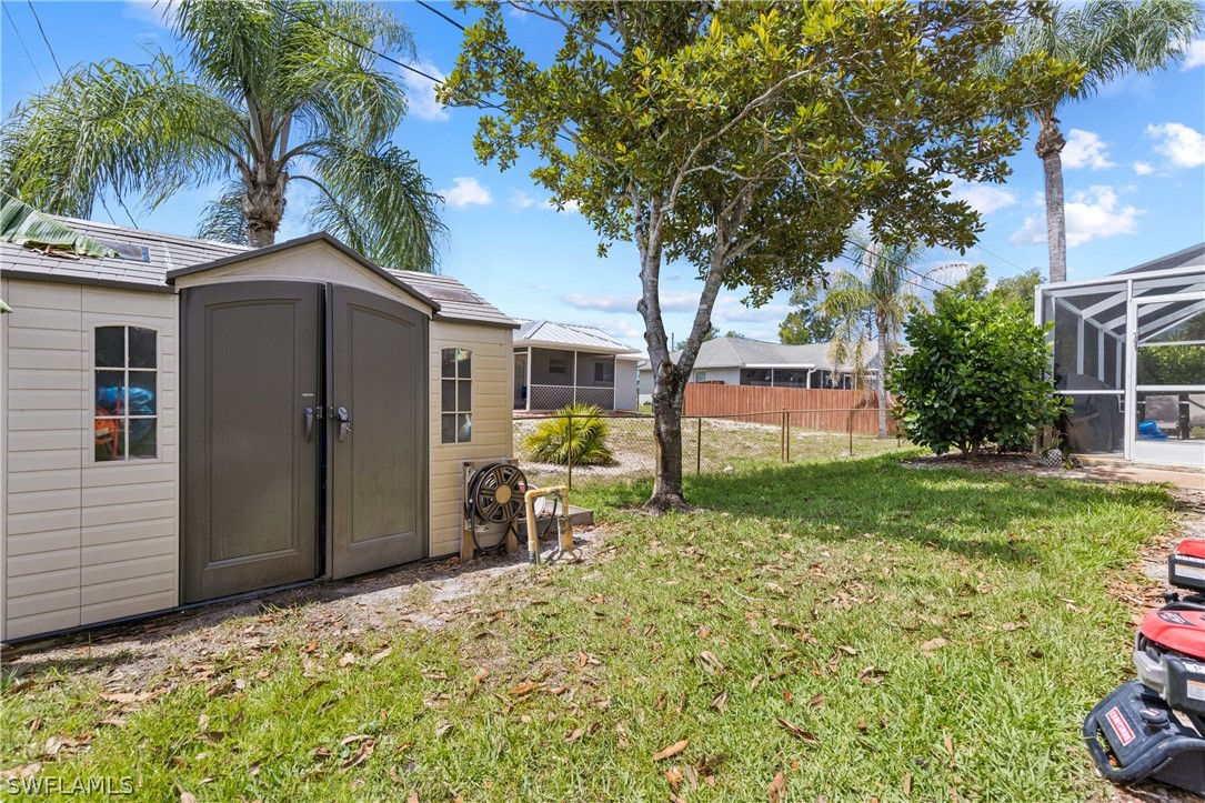 9132 Bryant Road Fort Myers, FL 33967 - Photo 23 of 23 a front view of a house with garden