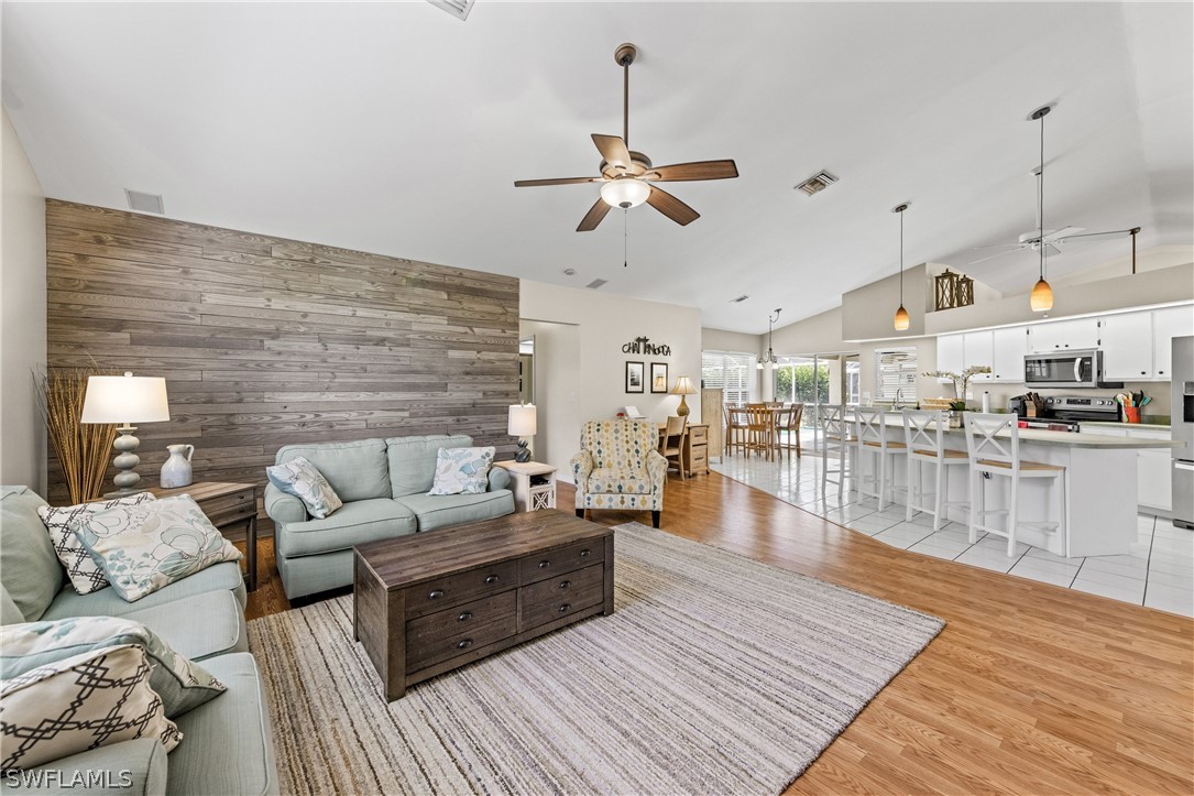 9132 Bryant Road Fort Myers, FL 33967 - Photo 4 of 23 a living room with furniture and kitchen view