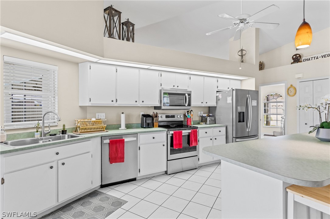 9132 Bryant Road Fort Myers, FL 33967 - Photo 7 of 23 a kitchen with stainless steel appliances granite countertop a sink and cabinets