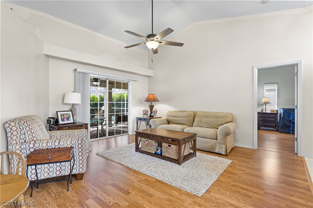 9132 Bryant Road Fort Myers, FL 33967 - Photo 9 of 23 a living room with furniture and wooden floor