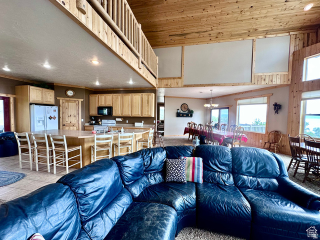 1940 East Shore Road St. Charles, ID 83272 - Photo 23 of 64 Living room with a high wood ceiling, light tile patterned floors, and suspended lighting