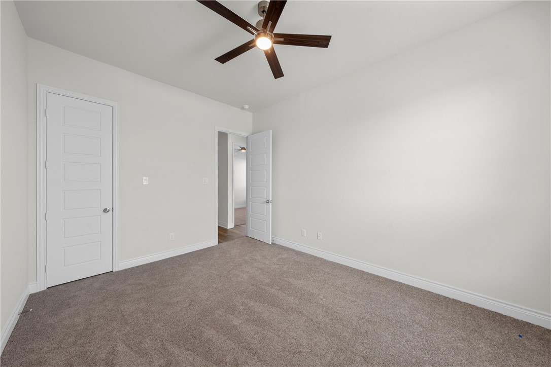 6402 Waggoner Court Temple, TX 76502 - Photo 20 of 30 a view of a livingroom with a ceiling fan & window