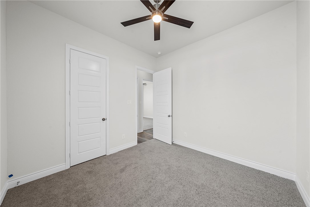 6402 Waggoner Court Temple, TX 76502 - Photo 25 of 30 an empty room with chandelier fan