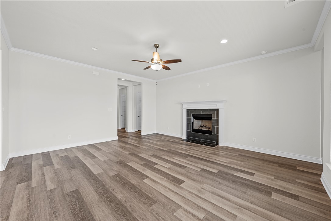 6402 Waggoner Court Temple, TX 76502 - Photo 6 of 30 a view of empty room with wooden floor and ceiling fan