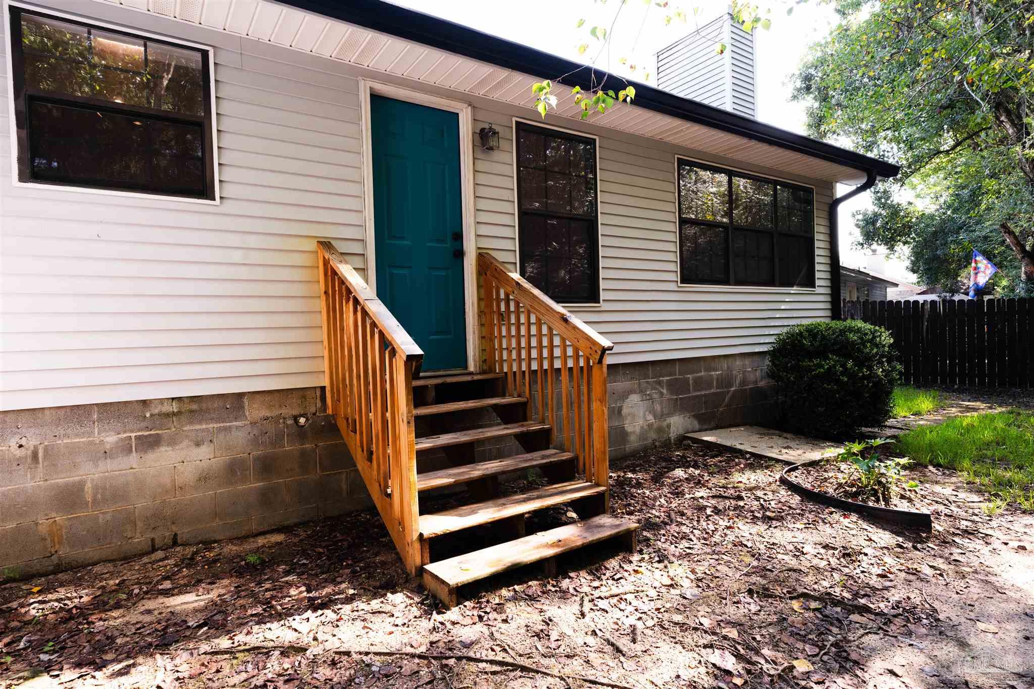 1156 Signal Hill Lane Pensacola, FL 32514 - Photo 15 of 16 a view of a house with a yard