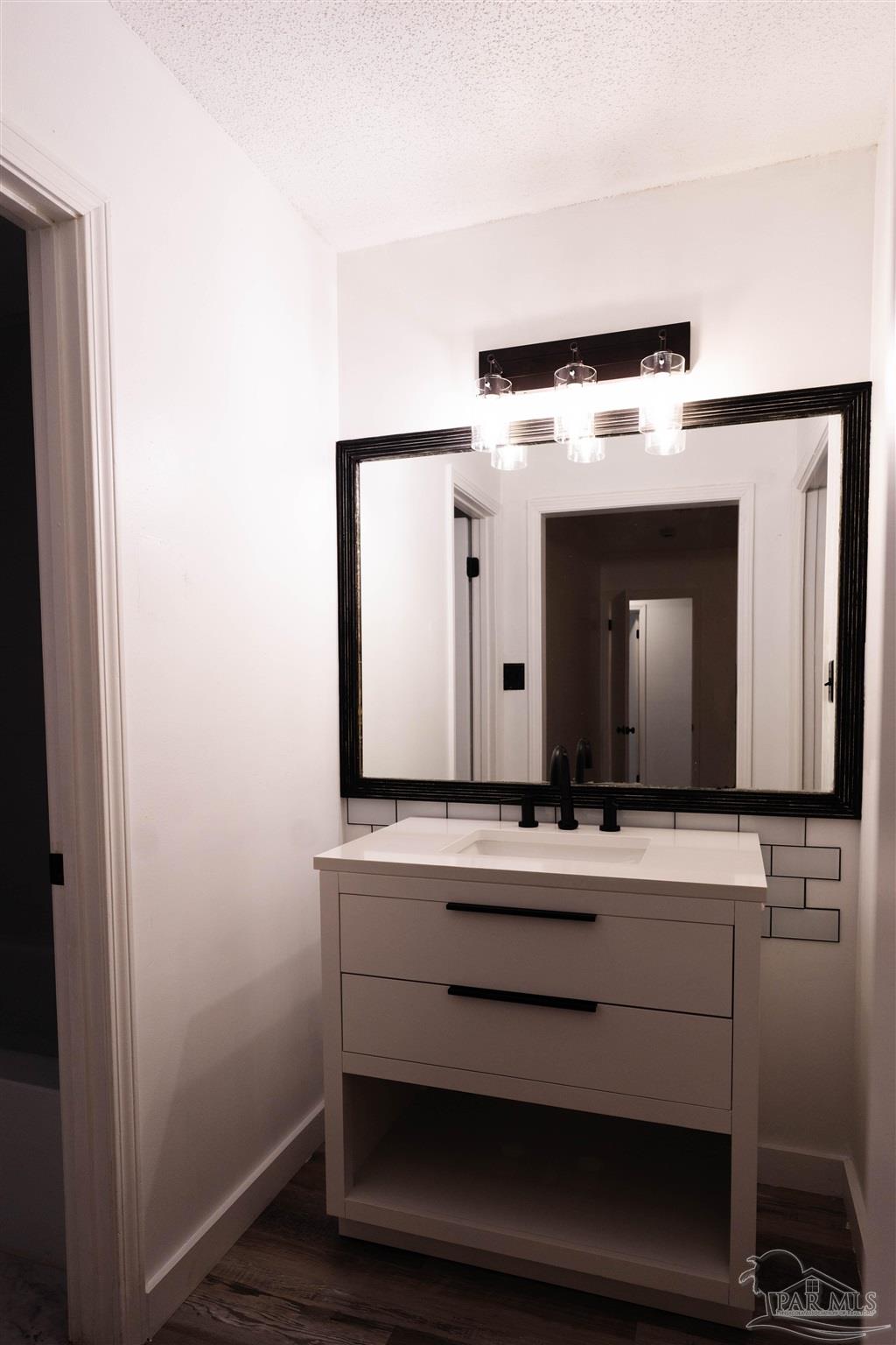 1156 Signal Hill Lane Pensacola, FL 32514 - Photo 16 of 16 a bathroom with a sink and a mirror