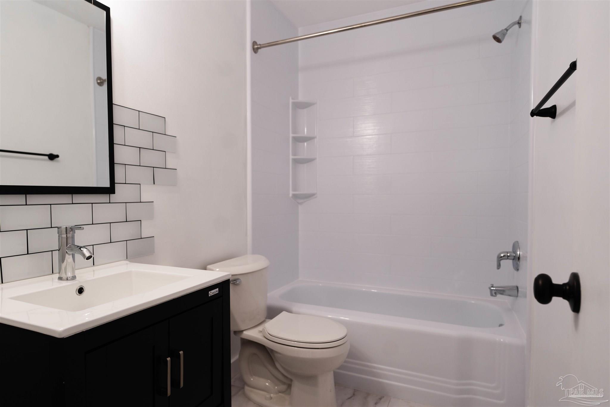 1156 Signal Hill Lane Pensacola, FL 32514 - Photo 6 of 16 a bathroom with a sink a toilet and shower