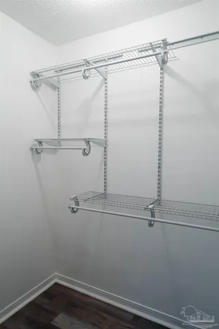 a view of a room with racks on the wall