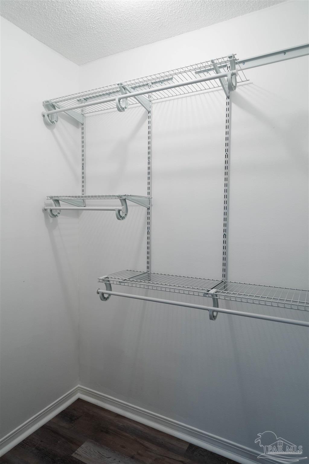 1156 Signal Hill Lane Pensacola, FL 32514 - Photo 9 of 16 a view of a room with racks on the wall