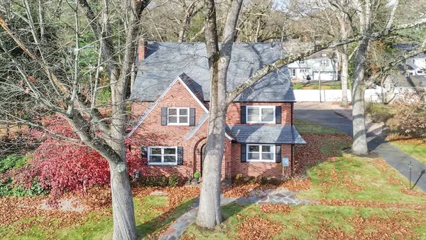 a front view of a house with yard