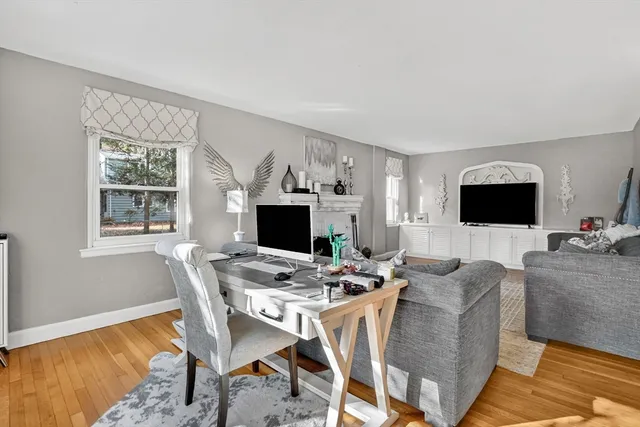 a workspace with furniture and a flat screen tv