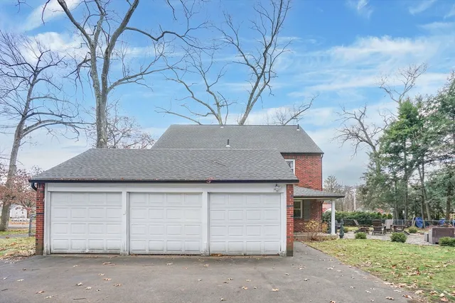 a house that has a tree in front of it