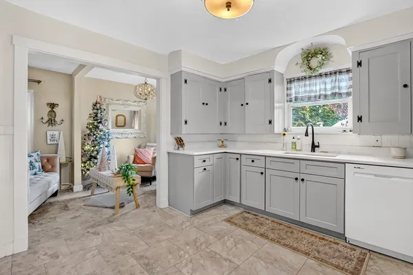 a spacious en suite bathroom with a sink double vanity and a mirror