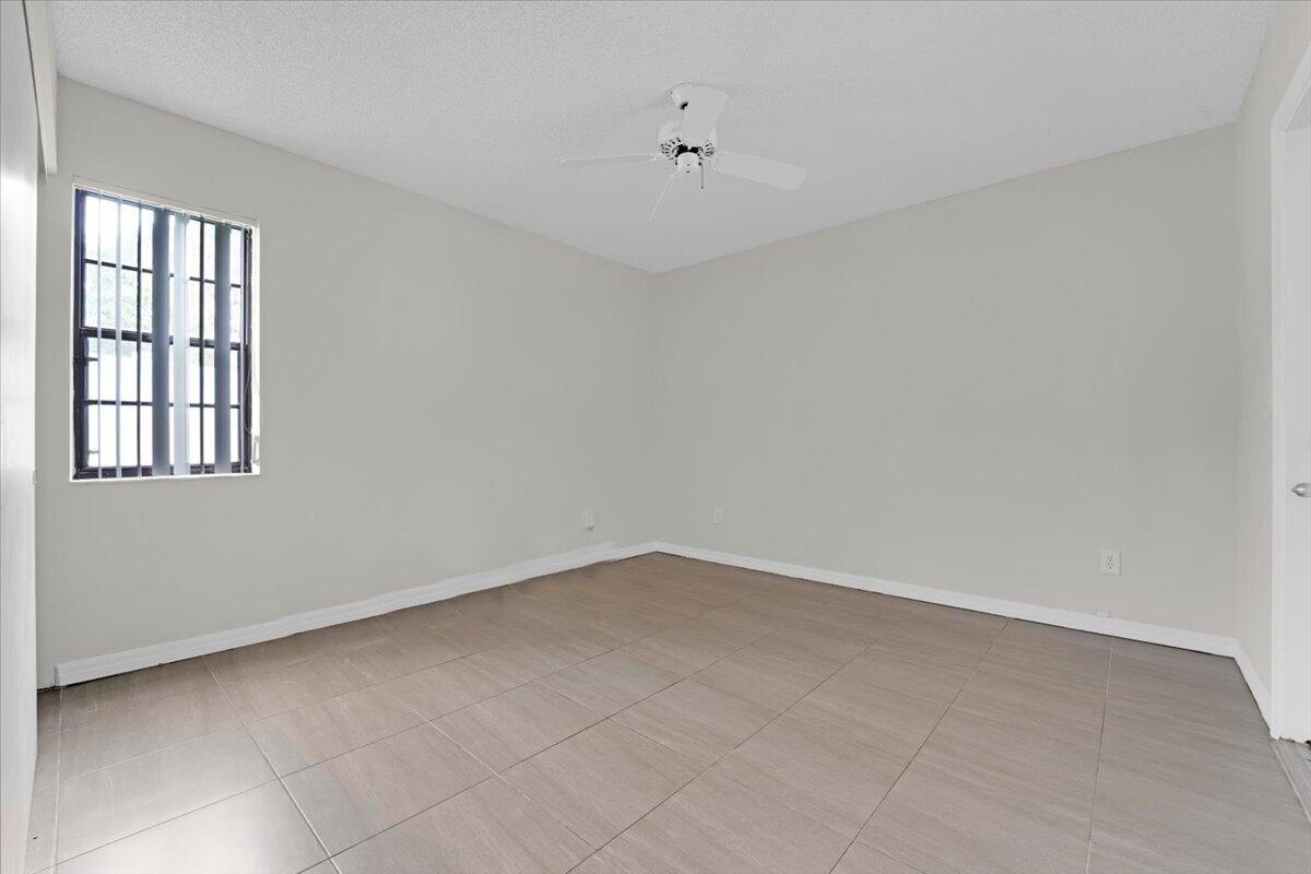 21575 Kapok Circle Boca Raton, FL 33433 - Photo 11 of 27 a view of an empty room with a window