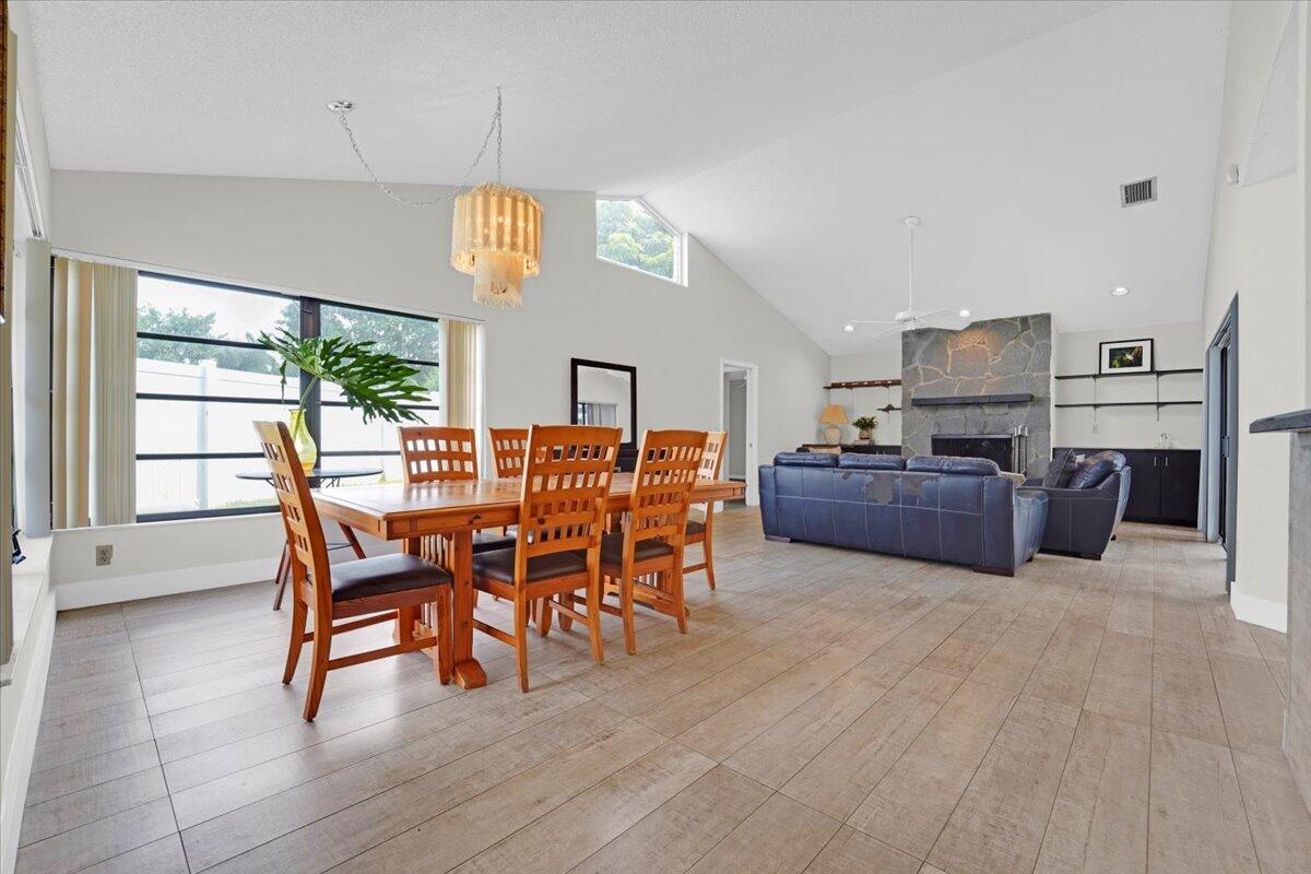 21575 Kapok Circle Boca Raton, FL 33433 - Photo 14 of 27 a view of a dining room with furniture window and wooden floor