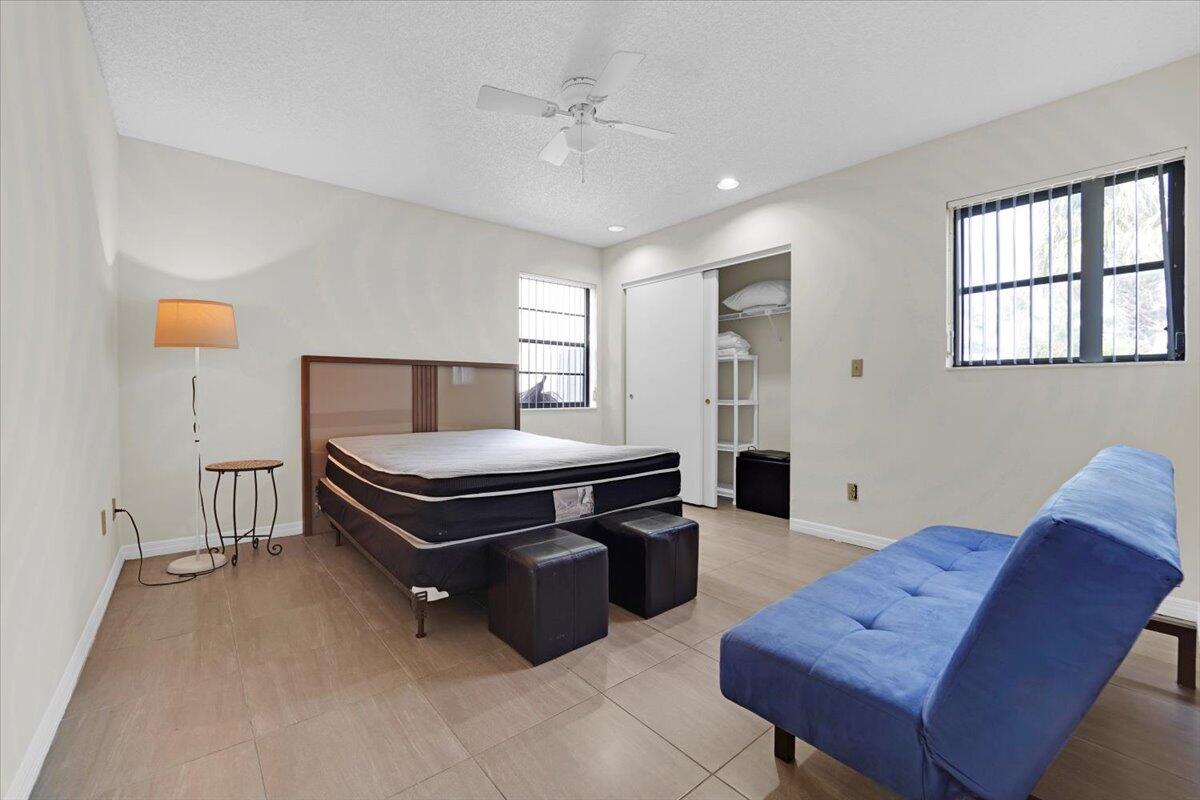 21575 Kapok Circle Boca Raton, FL 33433 - Photo 25 of 27 a living room with furniture and wooden floor