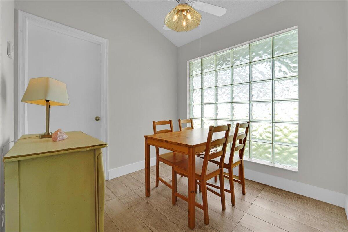 21575 Kapok Circle Boca Raton, FL 33433 - Photo 26 of 27 a view of a dining room with furniture and a window