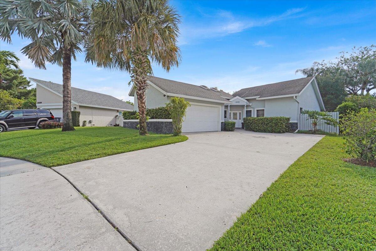 21575 Kapok Circle Boca Raton, FL 33433 - Photo 5 of 27 a house with tree in front of it