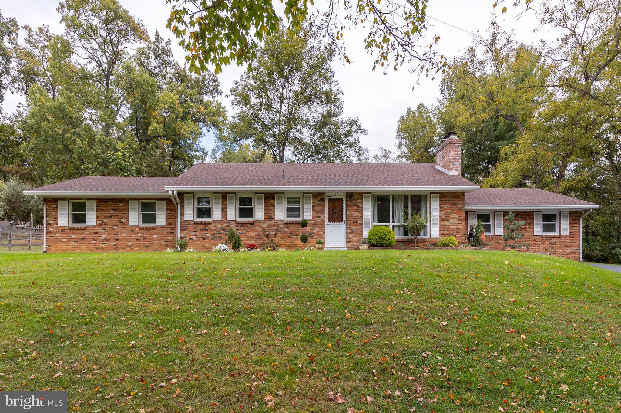 411 Rest Church Road Winchester, VA 22603 - Photo 1 of 46 Charming brick home on a lush green lot.