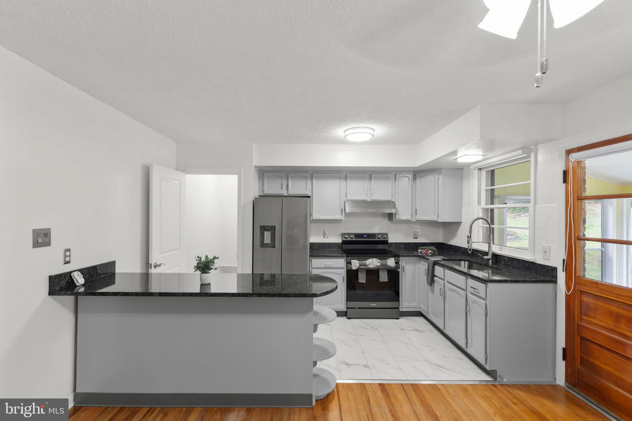 411 Rest Church Road Winchester, VA 22603 - Photo 11 of 46 Modern kitchen with sleek finishes.