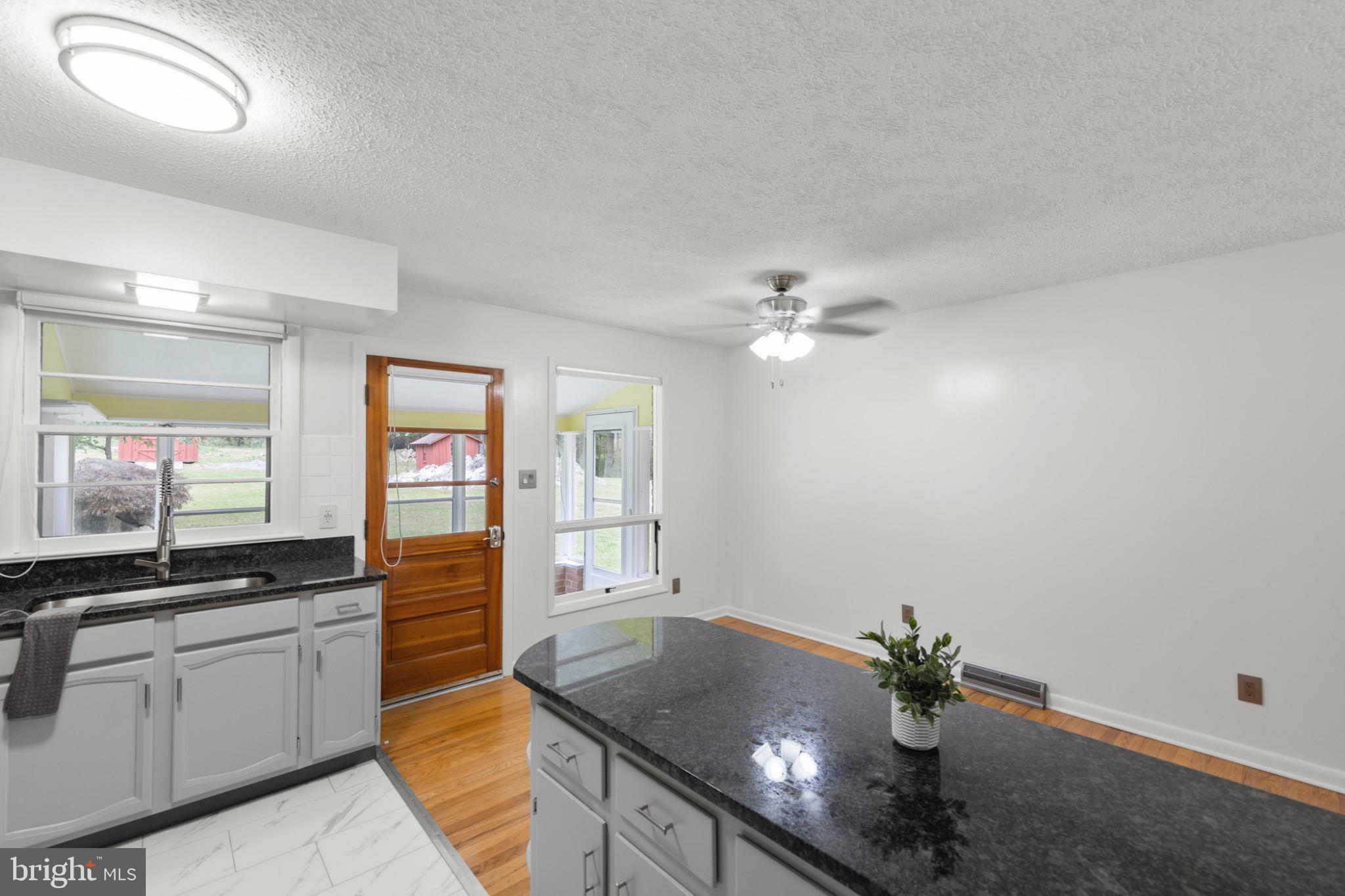 411 Rest Church Road Winchester, VA 22603 - Photo 14 of 46 Bright and inviting kitchen with modern charm.