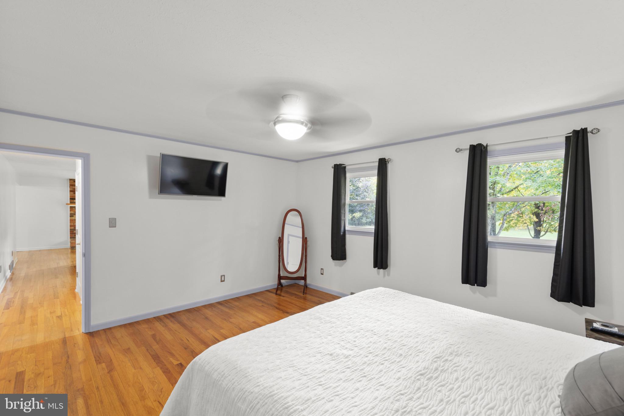 411 Rest Church Road Winchester, VA 22603 - Photo 20 of 46 Bright and airy bedroom with modern touches.