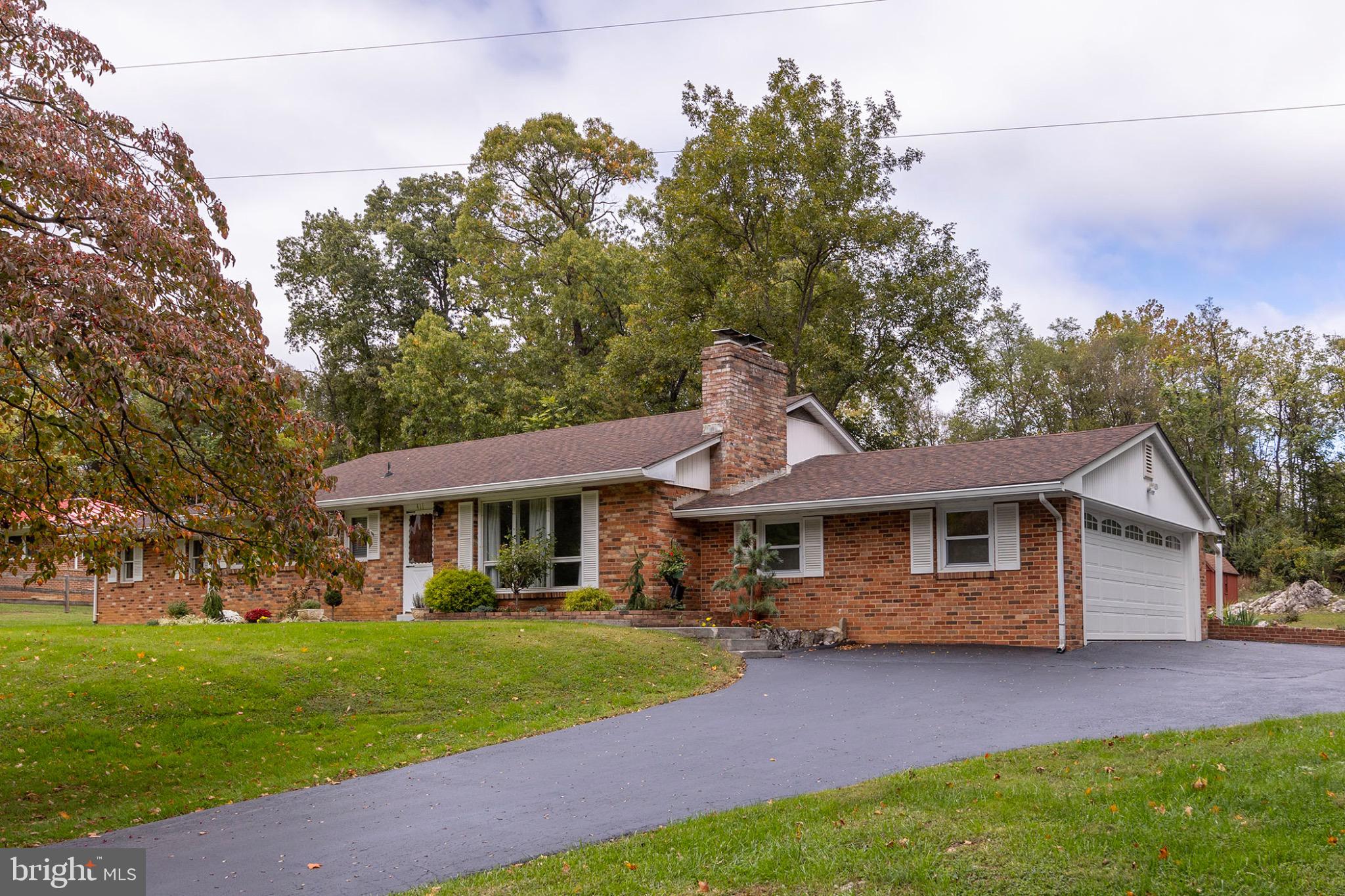 411 Rest Church Road Winchester, VA 22603 - Photo 2 of 46 Charming brick home with lush surroundings.